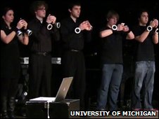 <img style="float:right;" src="http://newsimg.bbc.co.uk/media/images/46852000/jpg/_46852409_mopho-seamus-30.jpg"/>A group of US students will soon be performing their debut 'iPhone orchestra'. They have all made special iPhone apps some of which sound similar to normal instruments, and some don't. The iPhone musical instruments can be controlled using various features that the iPhone has like the microphone, touchscreen or accelerometer. According to the <a href="http://news.bbc.co.uk/2/hi/technology/8394148.stm"target="_blank">BBC</a>, the students will be performing their unique concert on 9th December. This comes after a three month couse led by Georg Essl, an Austrian computer scientist and musician. There has been music made by computers and gadgets for a relatively long time, but this concert will feature only iPhone apps created by the performers.
